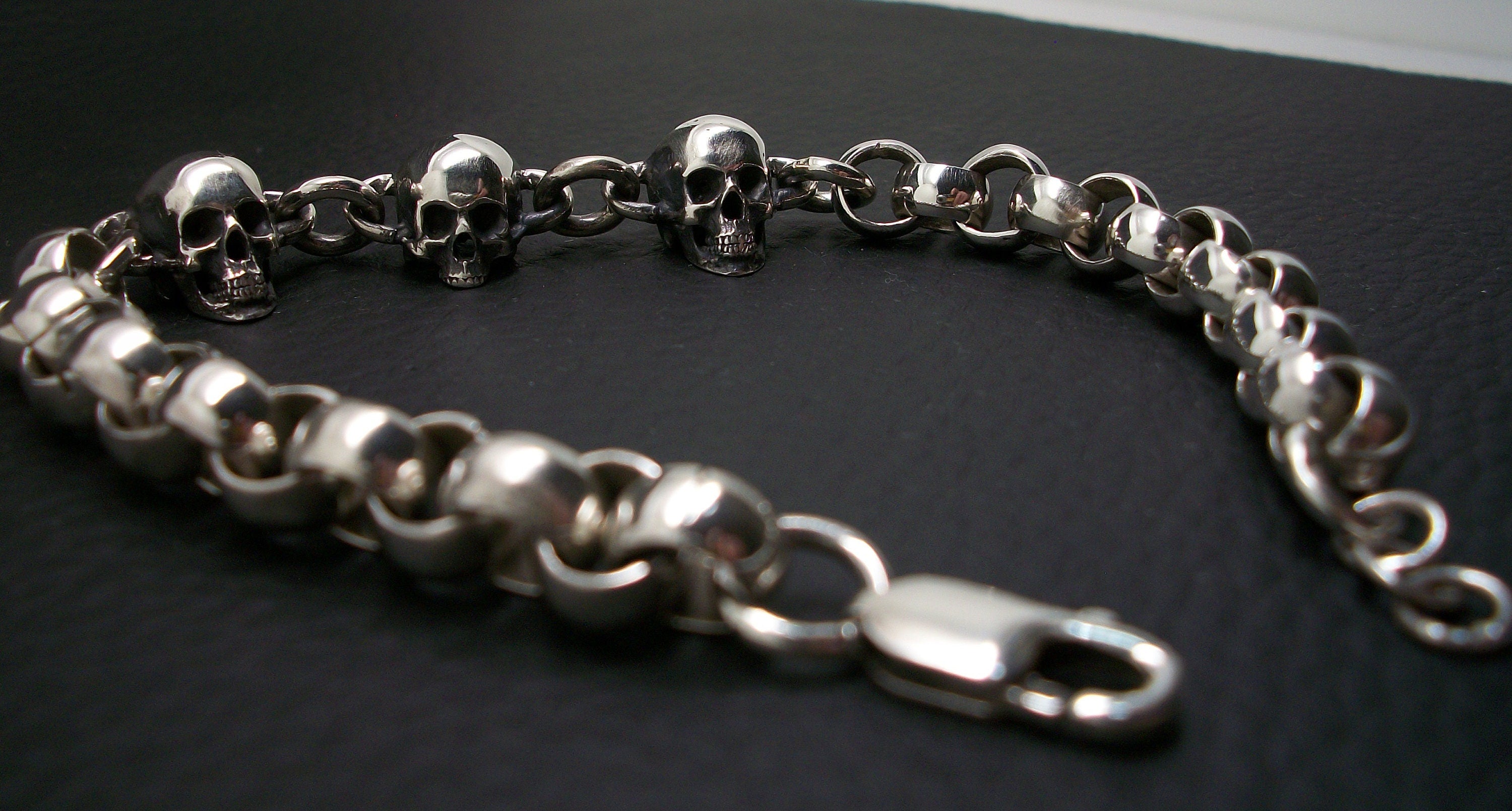 Skull Bracelet - Sterling Silver skull bracelet rolo chain. Lobster clasp closure.